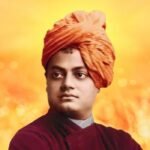Swami Vivekananda posing in his iconic orange turban and robe.