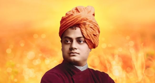 Swami Vivekananda posing in his iconic orange turban and robe.