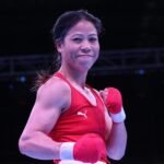 Mary Kom winning a boxing match representing India's strength.