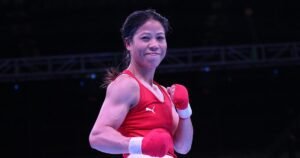 Mary Kom winning a boxing match representing India's strength.