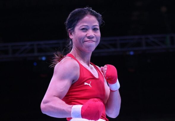 Mary Kom winning a boxing match representing India's strength.